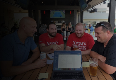 The XPONEX team reviewing a project with a client
